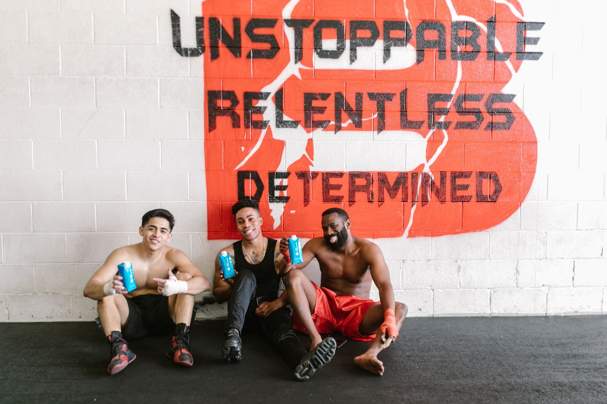 Athletes with functional beverage cartons after training
