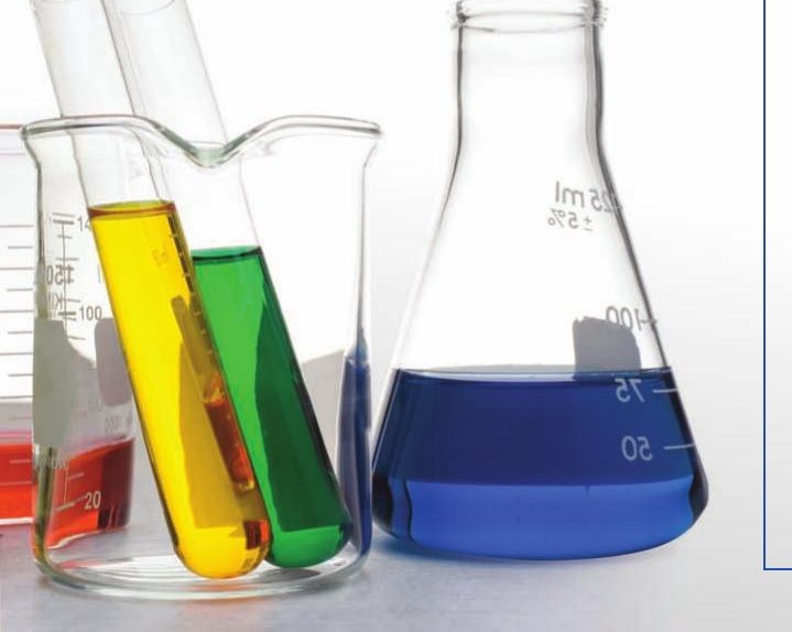 Lab glassware with colored liquids, representing SmartSorb beverage formulation
