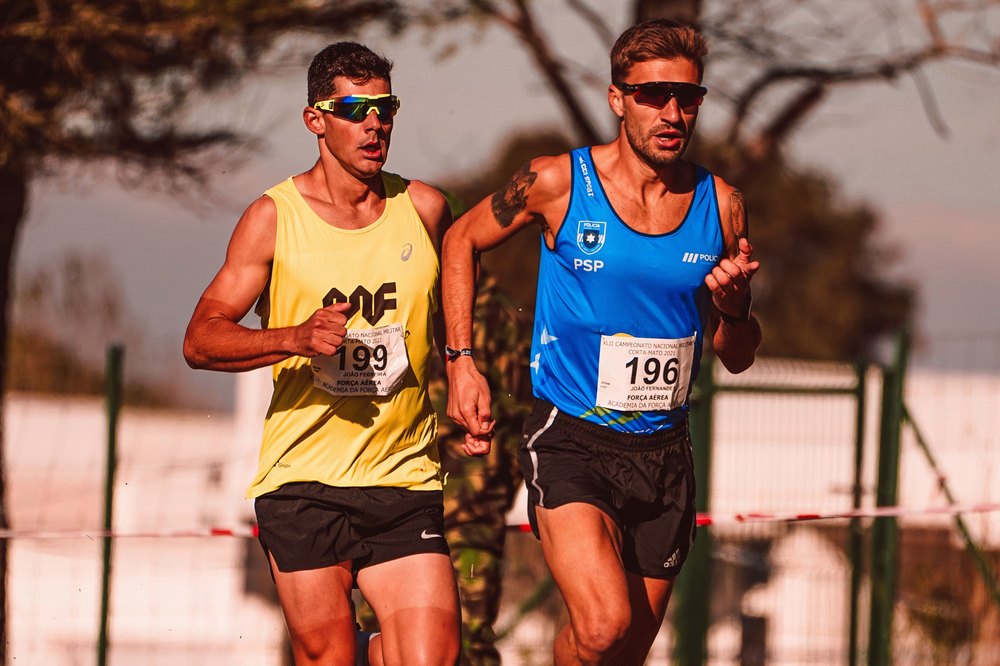 Two distance runners competing side by side
